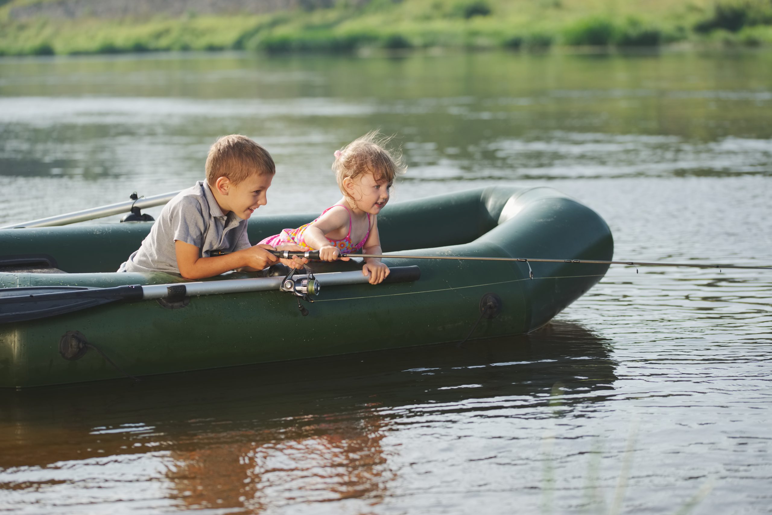 Children fishing in boat